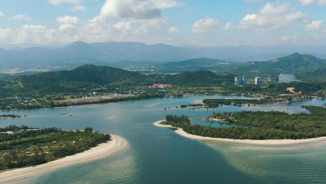 Aerial view of town Tuaran in a bay near the sea. Borneo, Malaysia.