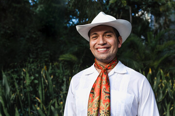 Latin man wearing traditional Mexican custom called "jarocho" traditional from Veracruz Mexico Latin America, young hispanic people in cultural Festival