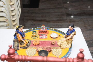 colorful clay dolls describing Tamil brahmin wedding couple on their wedding day