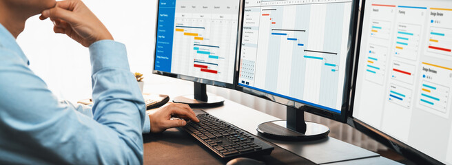Project manager planning schedules for business task on office using gantt chart software display on screen. Modern business management and work flow organization. Trailblazing