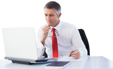 Digital png photo of caucasian businessman looking at laptop on transparent background