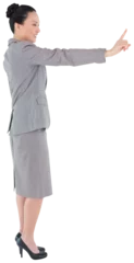 Papier Peint photo Lieux asiatiques Digital png photo of smiling asian businesswoman pointing with finger on transparent background