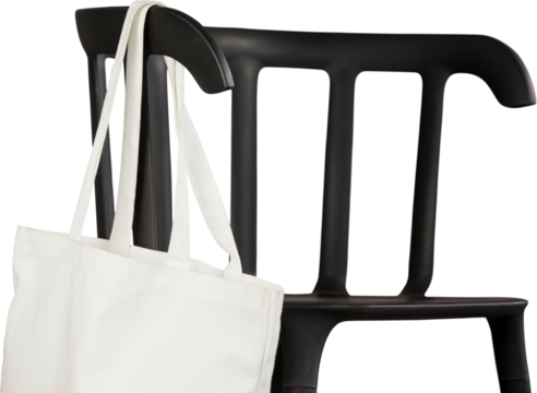 Digital png illustration of black chair with white bag on transparent background - Powered by Adobe