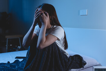 Insomnia at night concept, Selective focus at the  time in alarm clock and the person covering her...