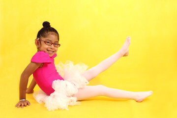 4-year-old Latina brunette girl dressed as a ballerina practices sport as therapy and ADHD treatment
