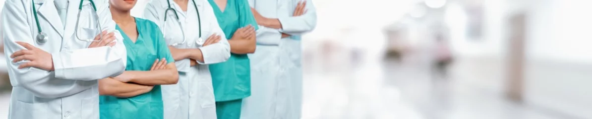 Foto op Canvas Confident medical staff team with doctor nurse and healthcare specialist professions people in blurry hospital corridor background. Medical and healthcare community in panoramic banner. Neoteric © Summit Art Creations
