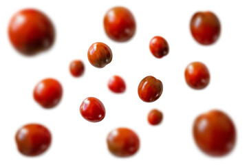 Levitating fresh juicy organic red cherry tomatoes from the garden isolated on a white background