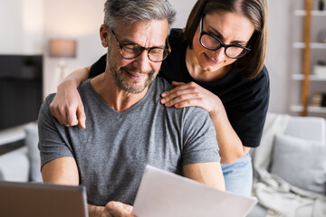Couple Doing Taxes And Family Budget