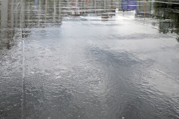 Wet sidewalk after rain on an autumn day