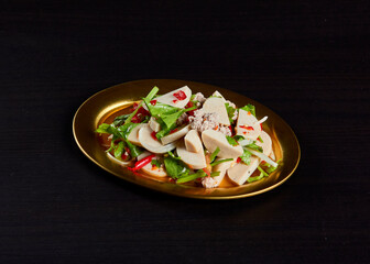 Spicy vermicelli salad pork, serve on gold stainless dish