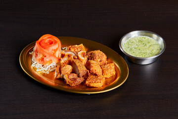 Fried pork belly, serve on gold stainless dish