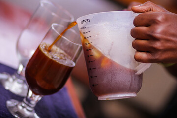 pouring coffee into glass