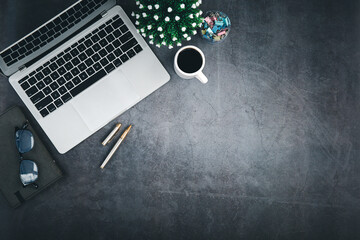 Top view desk office workspace and laptop and supply equipment with empty copy space for freelance working productive workplace area or home office flat lay background.