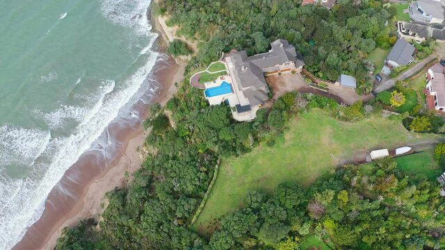 Aerial View from the Beach, Green Trees, City Streets, and Waves of Orewa in New Zealand - Auckland Area	