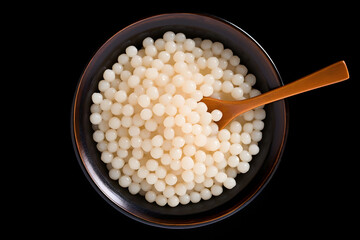 Tapioca pearls, chewy Brazilian dessert served in a bowl, top down