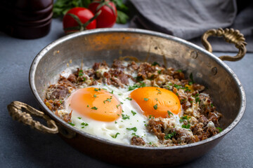 From traditional Turkish cuisine; fried eggs with meat. Turkish name; kavurmali yumurta