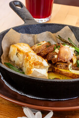 Fish dish - fried fish, fried potatoes and vegetables