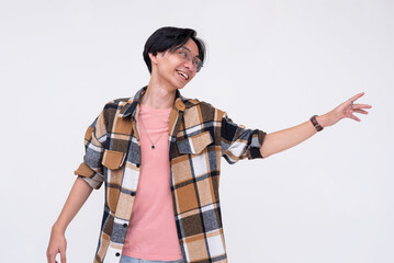 Scene of a happy and cheerful young asian man trying to reach out with his hand. Isolated on a...