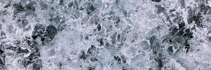 Abstract structure of a transparent block of ice. Graphic, monochrome background.