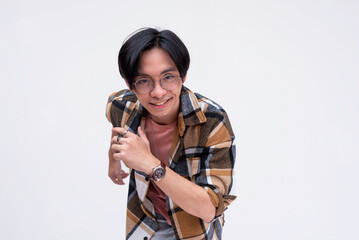 A young chinese man running forward in an exaggerated way. Active dynamic teenager in motion. Isolated on a white backdrop.