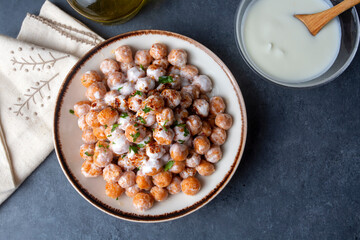 Traditional Turkish food, Mirik Kofte made from bulgur, onion and eggs with yoghurt
