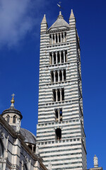 Fototapeta na wymiar Bell Tower of the Cathedral of Siena in the Tuscany Region in Central Italy
