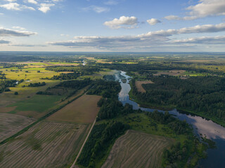 Aerial view from drone on the river and fields sunny summer day