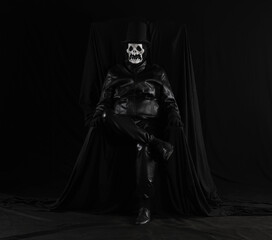 portrait of a man in a monster mask on a black background