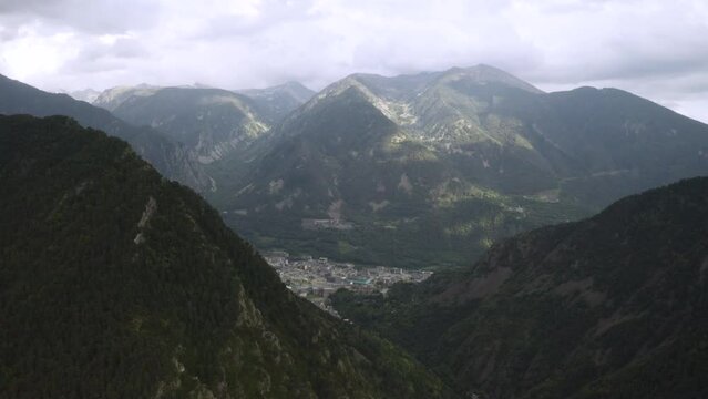 Opening drone shot of Andorra La Vella, city in the middle of Pirynees mountains