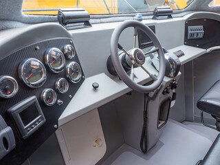 Motor boat. Seat of captain of yacht. Steering wheel of motor boat. Small marine vessel control...