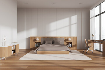 Cozy home bedroom interior with bed, table and panoramic window. Empty wall