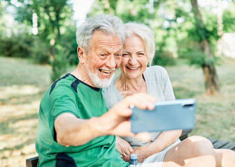 woman man outdoor senior couple happy lifestyle retirement together love elderly video call selfie photo mobile smartphone communication phone sport active fitness outfit training healthy