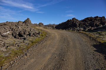 A view of the dirt road among the lava fields. Helgafellssveit, Iceland.