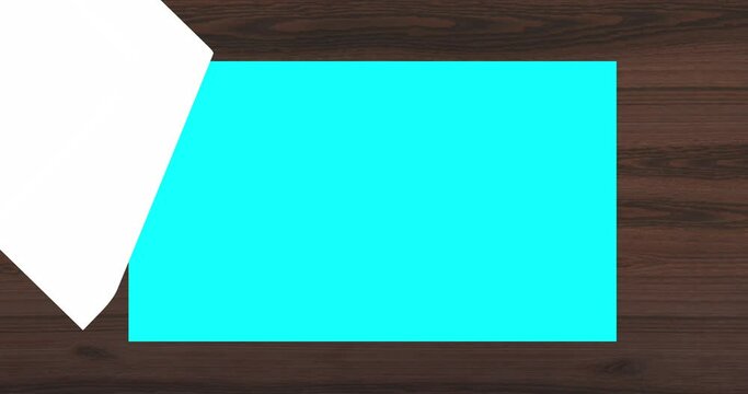 colorful paper turning on wooden table,wedding invitation paper turning effect,colorful book paper flipping animation