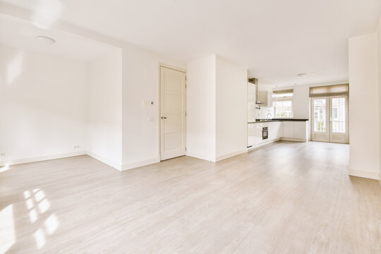 Spacious bright white kitchen with windows
