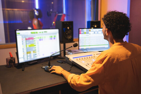 Man approving while recording vocal sound in studio