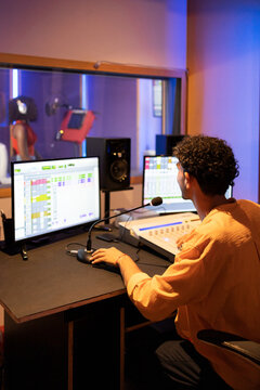 Man approving while recording vocal sound in studio