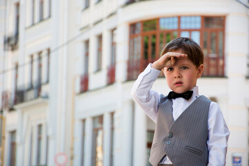 kid fashion for wedding. tuxedo and tux style for kid. boy elegance in bow tie. small boy in...