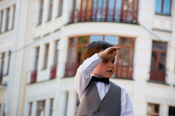 tuxedo and tux style for kid. boy elegance in bow tie. small boy in elegant tuxedo outdoor. little...