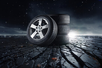 Car tires with a great profile on rough stone pavement - asphalt, smoke
