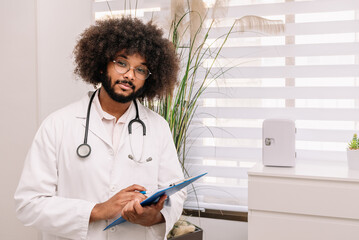 Man with clipboard in hospital