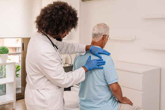 Curly haired doctor examining patient