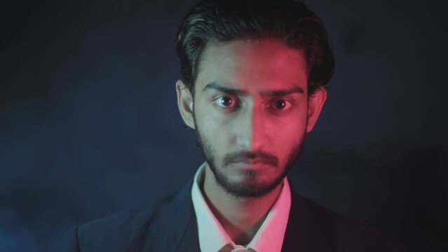 Cinematic shot of a young man in a stylish suit giving facial expressions of finished. Dramatic film-like stock footage - 24 fps - ProRes