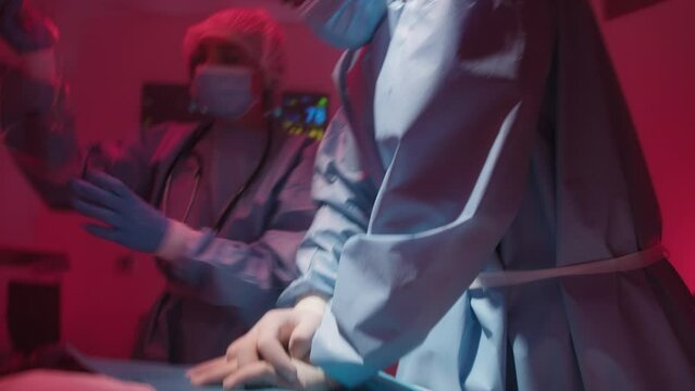 Doctor performs cardiopulmonary resuscitation for an emergency cardiac arrest