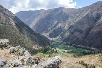 Fototapeta na wymiar Cusco, Peru - Dec 3, 2022: The Inca Ruins of Pumamarca, near the town of Ollantaytambo