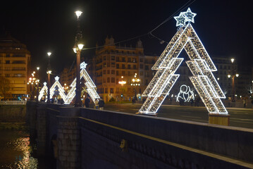 San Sebastian, Spain - Dec 12, 2022: Christmas illuminations along the Urumea river