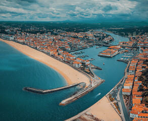 Scenic drone panoramic view on Saint Jean de Luz harbor. Coastal european touristic beach town. Travel France