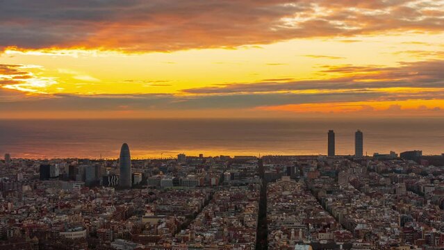 Night to day sunrising timelapse over Barcelona city skyline, Spain