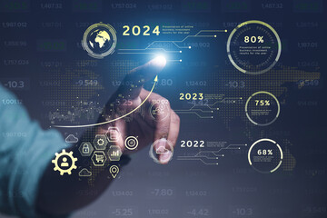 Concept 2024, modern online technology businessman displays charts, stock market charts and rising...