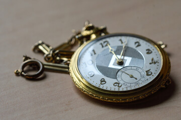 closeup of an antique gold pocket watch